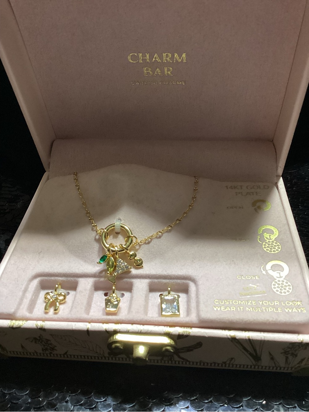 Gold Necklace with Green Leaf and Clear Stone Charms